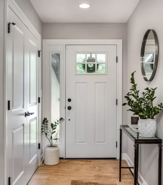 A,Cozy,Entryway,With,Brown,And,Brick,Walls,,Hardwood,Flooring,